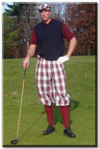 Mens traditional plaid flat front golf pants tailor-made with a baggy fit for mobility and slash pockets, a zipper fly, and elastic cuffs.