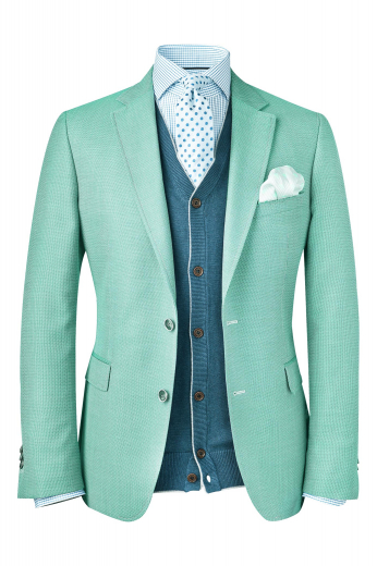 A handmade wool and cashmere blend blazer with a tailor made single-breasted, made to measure two-button high notch lapel design, custom tailored elegantly.

