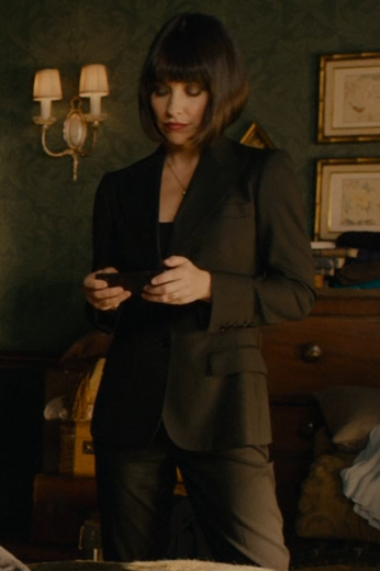 Woman’s custom tailored mono-chromatic suit from Hollywood. This is a custom tailored black suit made as a custom Hollywood costume for sale online.